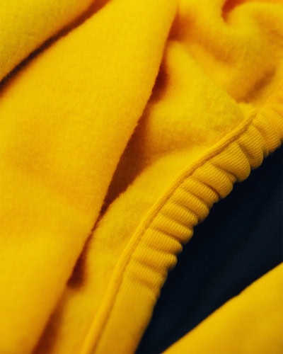 Soft breathable car cover material close to a vehicle surface