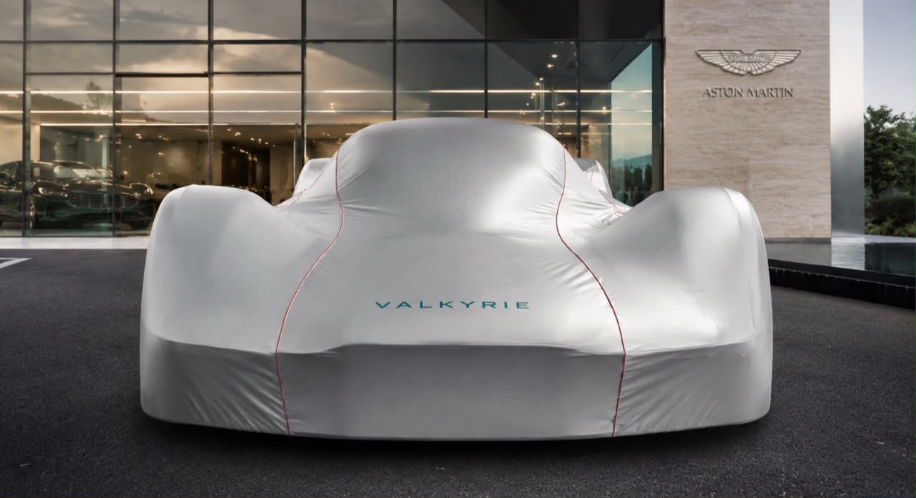 Tailored Aston Martin Valkyrie cover outside an Aston Martin showroom